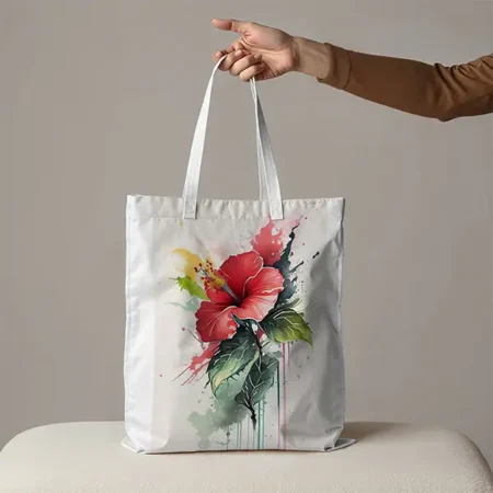 A white tote bag with a large, watercolor-style print