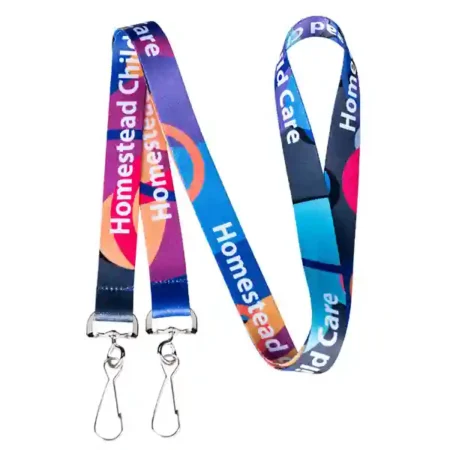 A vibrant, full-color custom lanyard with an abstract, multicolored design and repeating text for a child care business.